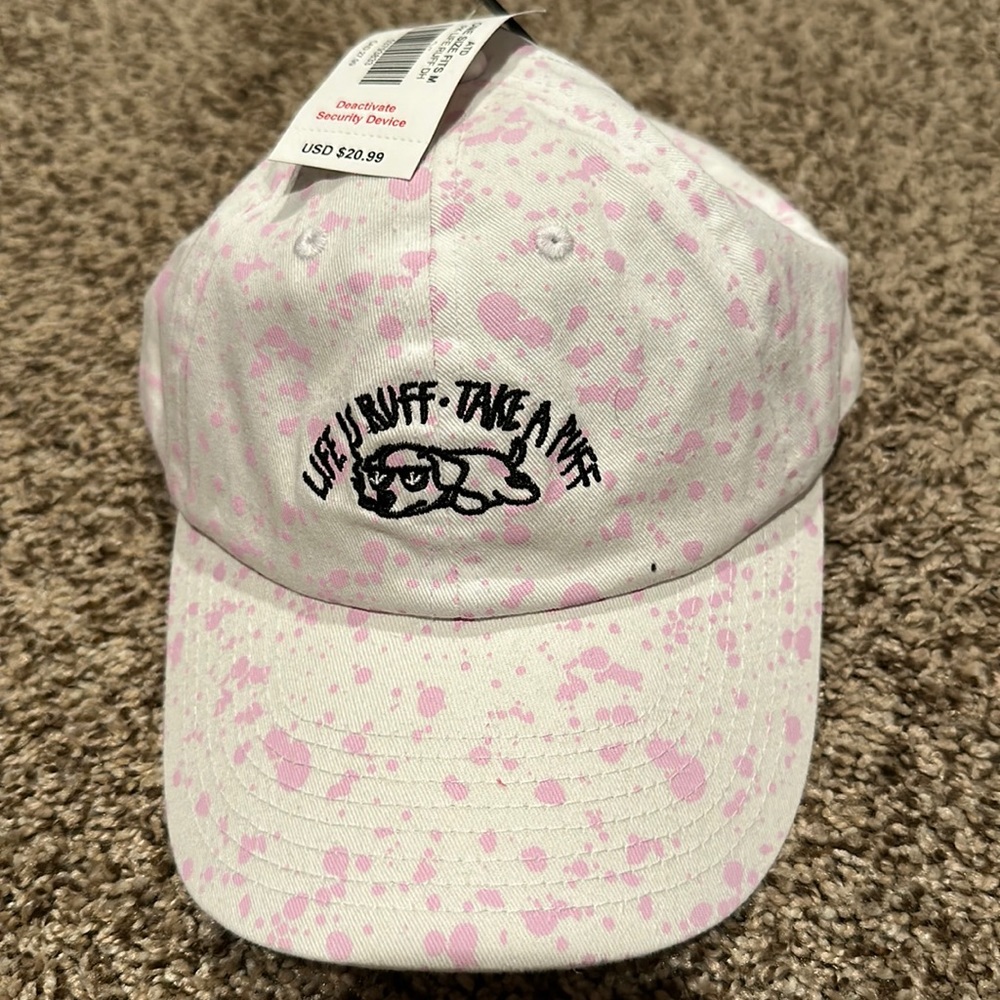 New with tags Spencer’s paint splatter hat “life is ruff take a puff”